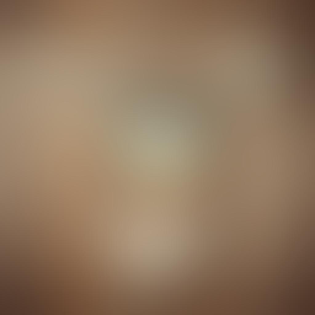 A vintage-inspired bathing suit hanging on a rustic wooden clothesline surrounded by nostalgic family photos in faded frames. Show an ethereal beach background with gentle waves lapping at the shore, evoking memories of summer gatherings. Include elements like seashells and old postcards scattered at the base, reflecting a rich family heritage. soft focus. warm tones. vintage style.